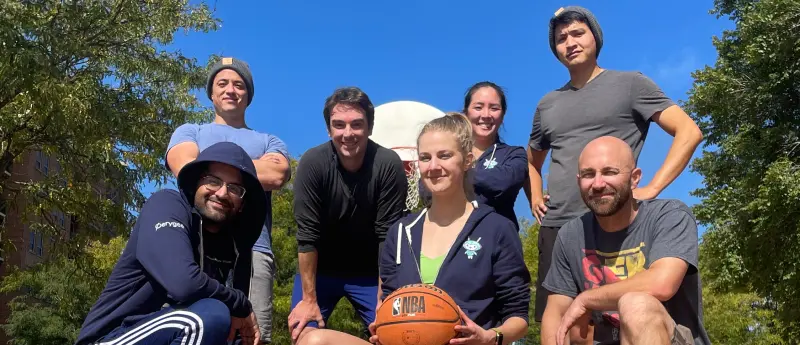 The Perygee team in person playing basketball
